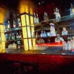 Wide angle view of bottles behind bar