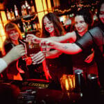 Skinny's staff toasting drinks
