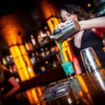Raina pouring a blue drink