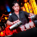 Bartender pouring drinks